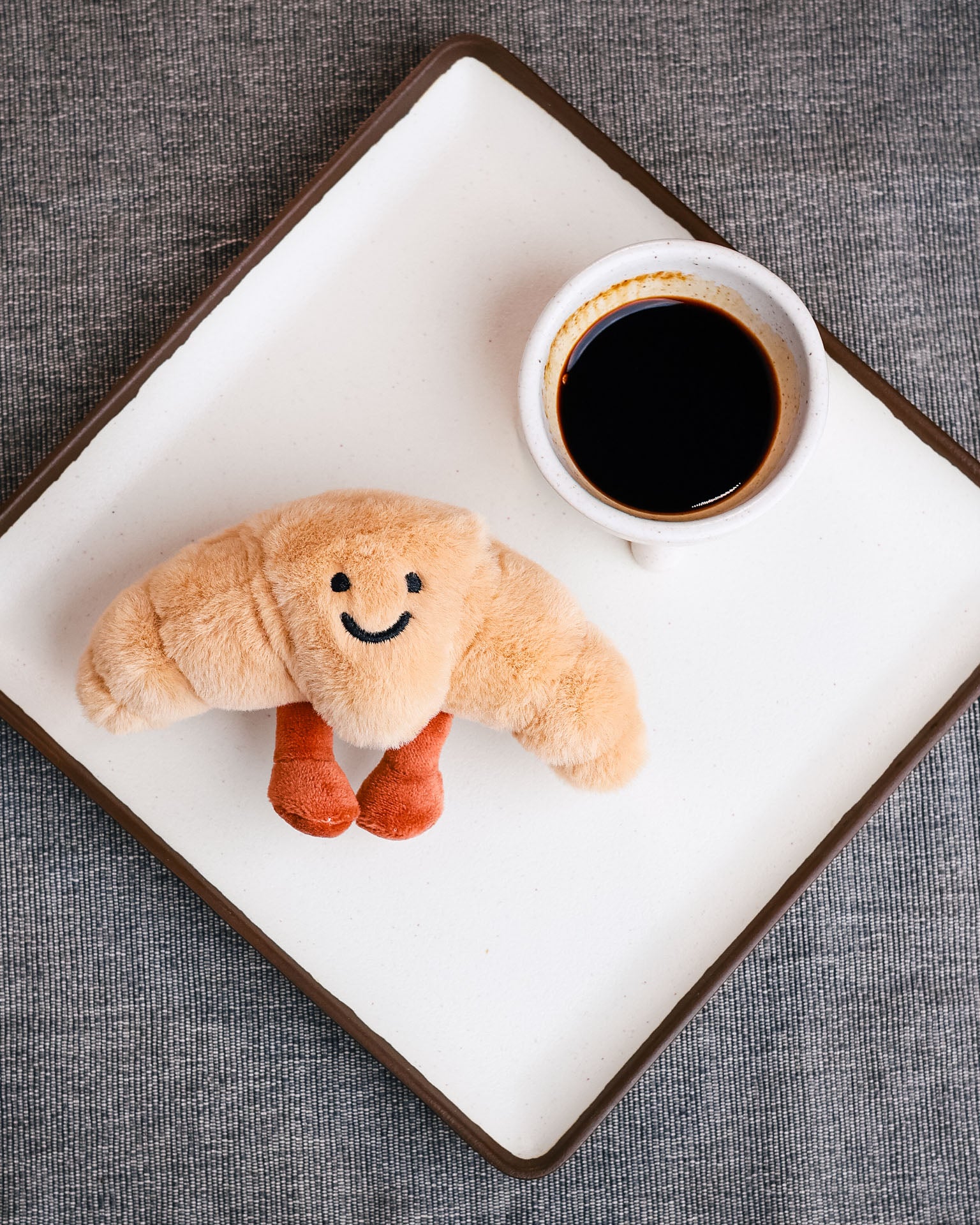 The Croissant plush lanyard for phone â€“ soft Croissant charm, quirky phone accessory